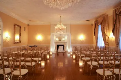 a room with rows of chairs and a chandelier at 3 West Club in New York