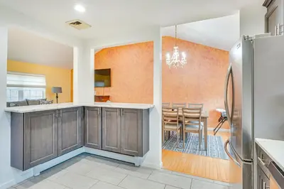 a kitchen and dining room with a dining table at 4 Mi to Hudson River Cozy Newburgh Home! in Newburgh