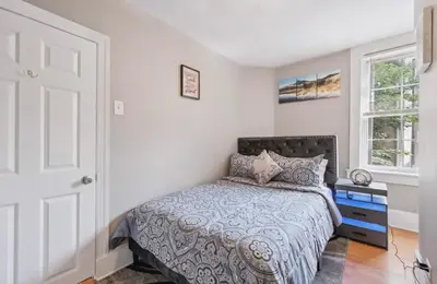 a bedroom with a bed and a window at The Prime in Philadelphia