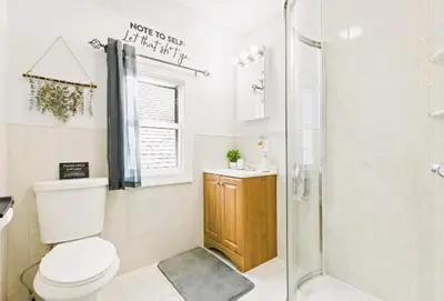 a bathroom with a shower and a toilet and a sink at W3S - Large 7br 3bath - Sleeps 20 - 3 Living rooms - Yard and Deck in Bayonne