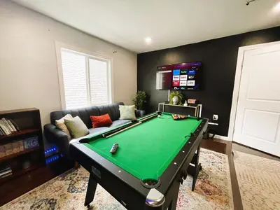 a living room with a pool table in it at W3S - Large 7br 3bath - Sleeps 20 - 3 Living rooms - Yard and Deck in Bayonne