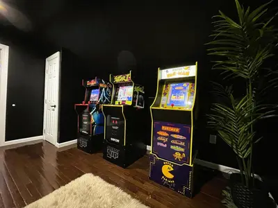 four video games are lined up against a wall at W3S - Large 7br 3bath - Sleeps 20 - 3 Living rooms - Yard and Deck in Bayonne