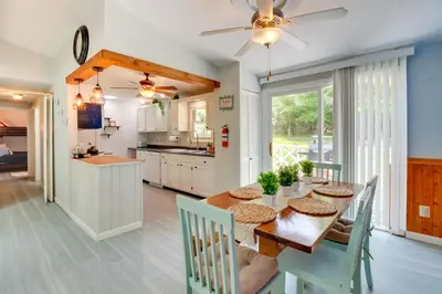 a kitchen and dining room with a table and chairs at Community Pools and Hot Tub Albrightsville Cottage! in Albrightsville