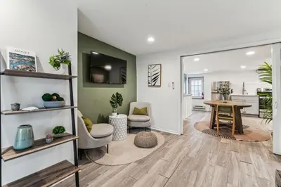 a living room with a table and a dining room at Luxurious couples suite KING BED, romantic, central, wifi in Philadelphia