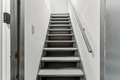 a stair case in a building with a bunch of stairs at Luxurious couples suite KING BED, romantic, central, wifi in Philadelphia