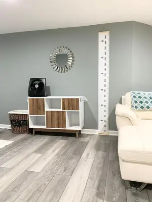 a living room with a white couch and a mirror at Semi Private cozy studio near downtown. in Montclair