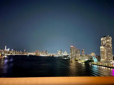 a view of a city skyline at night at Double Room in New York