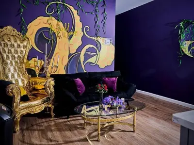 a living room with a black couch and a glass table at Siren's Cozy Cove Hideaway Mins from Downtown in Philadelphia