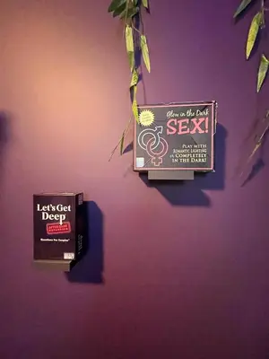 a wall with two signs on a purple wall at Siren's Cozy Cove Hideaway Mins from Downtown in Philadelphia