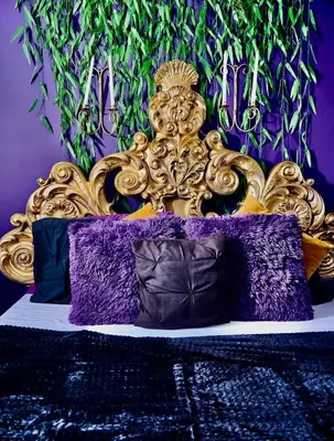a purple and gold bed with purple pillows at Siren's Cozy Cove Hideaway Mins from Downtown in Philadelphia