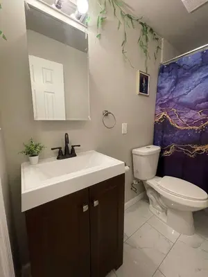 a bathroom with a sink and a toilet at Siren's Cozy Cove Hideaway Mins from Downtown in Philadelphia