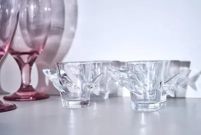 three empty glasses are sitting on a table at Siren's Cozy Cove Hideaway Mins from Downtown in Philadelphia