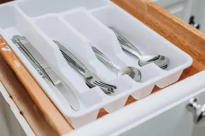 a drawer with utensils in a sink at NYC 2 Bed America Dream Mall Train Station in Newark