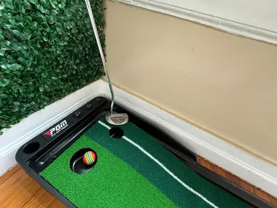 a miniature golf ball on a mini golf course at NYC 2 Bed America Dream Mall Train Station in Newark