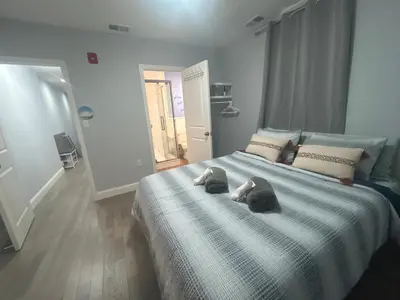 a bedroom with a bed with two stuffed animals on it at Cozy 2-3 Bedroom Apartment in Center City! in Philadelphia