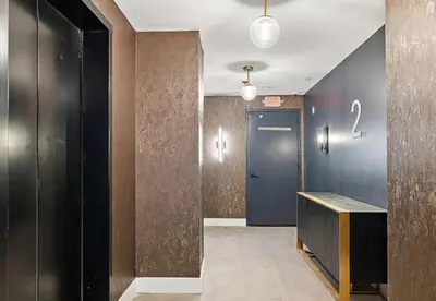 a hallway with a blue door and a number on the wall at Market View Residence 503 I 1 Bedroom 15 Bathroo in Wilmington