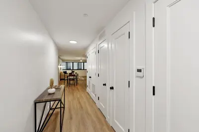 a hallway with white cabinets and a table in a room at Market View Residence 504 I 2 Bedroom 2 Bathroom in Wilmington
