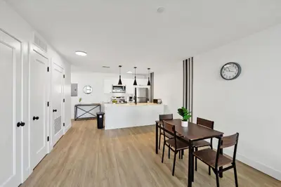 a kitchen and dining room with a table and chairs at Stunning 1bd1bth I New Construction in Wilmington