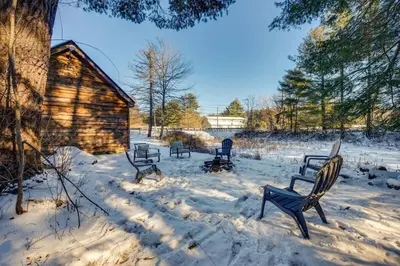a group of chairs sitting in the snow at The Cozy Cabin in Blakeslee