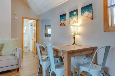 a dining room with a table and chairs at The Cozy Cabin in Blakeslee