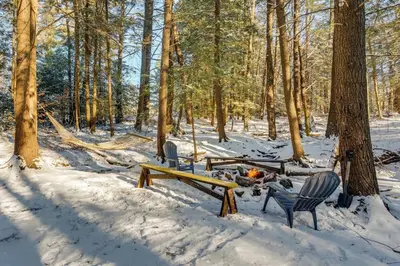 a picnic table and chairs in the snow at The Babbling Brooke in Blakeslee