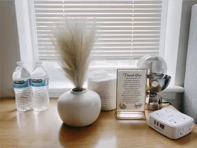 a vase with a plant in it sitting on a table at Lin Wood Retreat in Plainfield