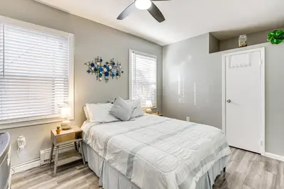a bedroom with a bed and a window at 1 Mi to Downtown Newark Urban Escape! in Newark