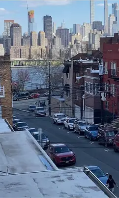 a view of a city street with cars parked at Entire House in West Ny, NJ12 mints from NYCity Time Square in West New York