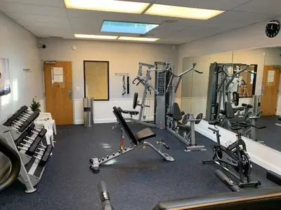 a gym with several treadmills and exercise bikes at Ski Camelback Mountain in Tannersville