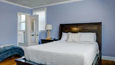 a bedroom with a large bed with blue walls at Home Away From Home in Philadelphia