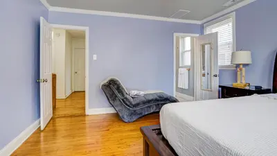 a bedroom with a bed and a chair in it at Home Away From Home in Philadelphia
