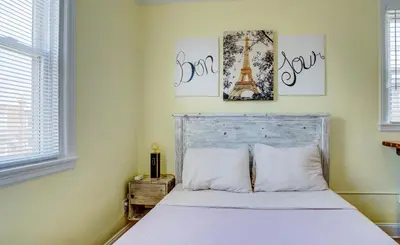 a bedroom with a bed with the words eiffel tower at Home Away From Home in Philadelphia