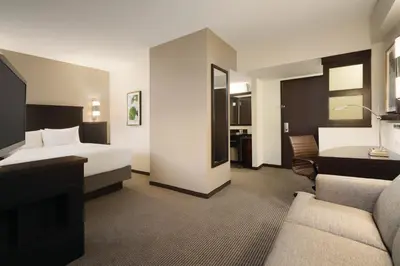 a hotel room with a bed and a couch at Hyatt Place Philadelphia/ King of Prussia in King of Prussia