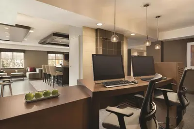 an office with a desk with a laptop and a chair at Hyatt Place Philadelphia/ King of Prussia in King of Prussia