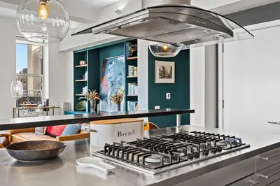 a kitchen with a stove with a box on it at Broadway Terrace by Rove Loft with Private Terrace in New York