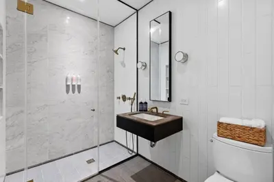 a bathroom with a sink and a shower at Clinton by Rove Travel 3BR Duplex with Backyard in New York
