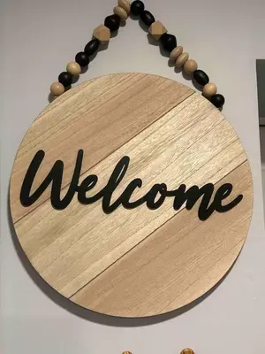 a wooden sign with the word welcome on it at Comfy, cozy, affordable and private - free parking in Richmond Valley