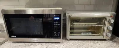 a microwave and a toaster oven sitting on a counter at Comfy, cozy, affordable and private - free parking in Richmond Valley