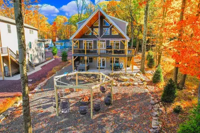 an aerial view of a house in the woods at New Luxury Lakeview Haven with Lake Access, HotTub, Game Room, Sleeps 26 in Lake Harmony