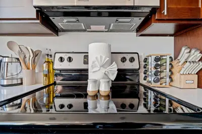a kitchen counter with a stove top oven at Modern 1BR Apartment Downtown Philly Near MET in Philadelphia