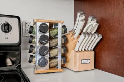 a bunch of knives in a wooden box on a counter at Modern 1BR Apartment Downtown Philly Near MET in Philadelphia