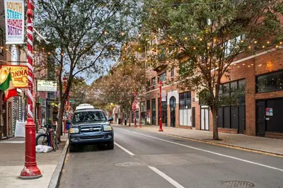 a car parked on the side of a city street at New 1-BD in Prime Philly Location with King Bed in Philadelphia