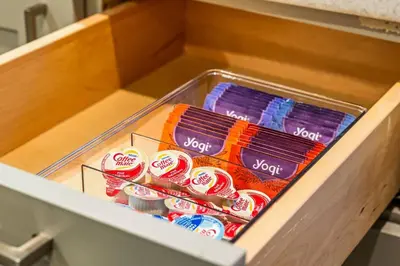 a drawer filled with lots of candy in a box at New 1-BD in Prime Philly Location with King Bed in Philadelphia