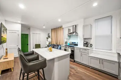 a kitchen with white cabinets and a counter top at New 1-BD in Prime Philly Location with King Bed in Philadelphia