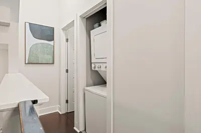 a kitchen with a white stove and a microwave at Luxury 3BR Rooftop Apartment Walk to MET and Metro in Philadelphia