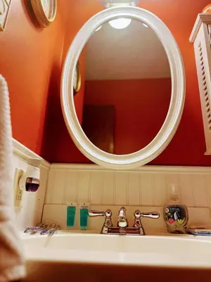 a bathroom with a sink and a mirror at The CubHouse Poconos getaway in Tobyhanna