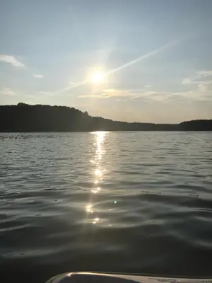 a view of a body of water with the sun setting at Dreamy Lake House - Fireplace, Firepit & Pet Friendly in Pocono Lake