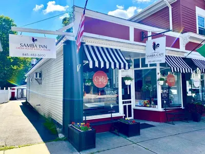 a store front of a restaurant with signs on it at In the clouds your cozy- lake house in Swan Lake