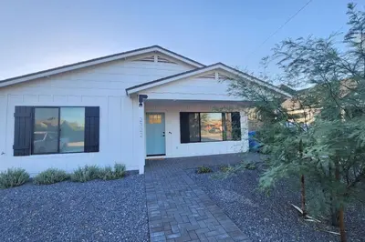 a white house with a driveway at Modern Living in PHX Heated Pool Arizona Charm in Philadelphia