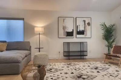 a living room with a couch and a table at Modern Living in PHX Heated Pool Arizona Charm in Philadelphia